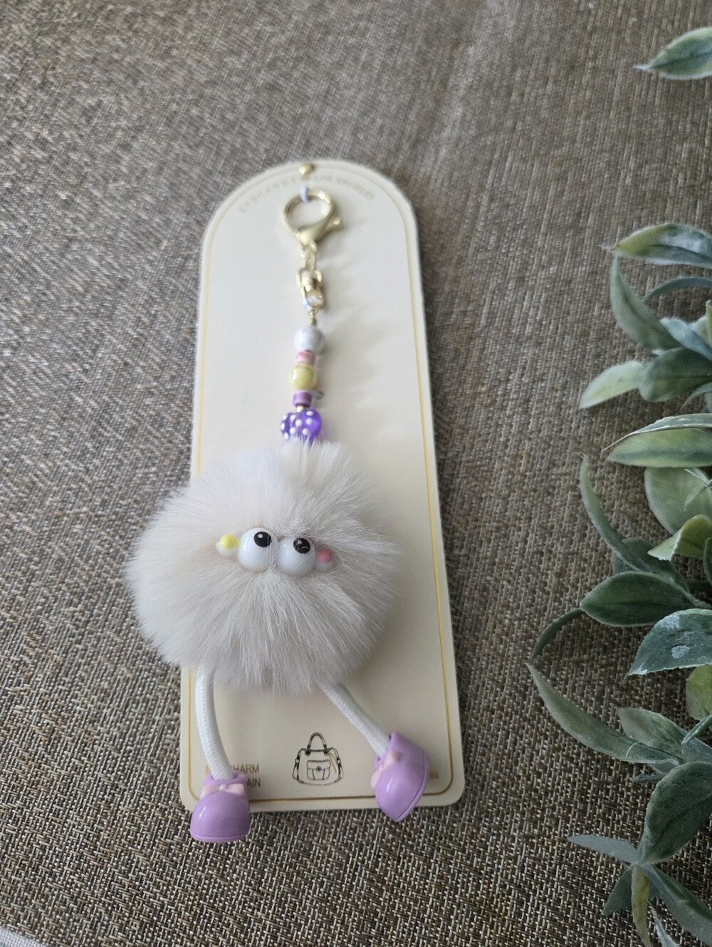 eye candy White Fuzzy Pom Keychain with Purple Shoes